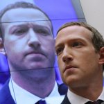 With an image of himself on a screen in the background, Facebook co-founder and CEO Mark Zuckerberg testifies before the House Financial Services Committee in the Rayburn House Office Building on Capitol Hill October 23, 2019, in Washington, DC.