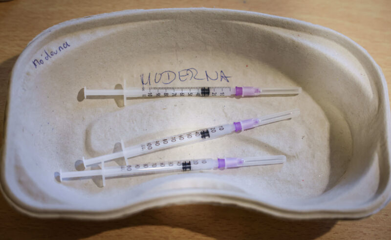 A tray of prepared syringes for booster vaccinations with Moderna's vaccine.