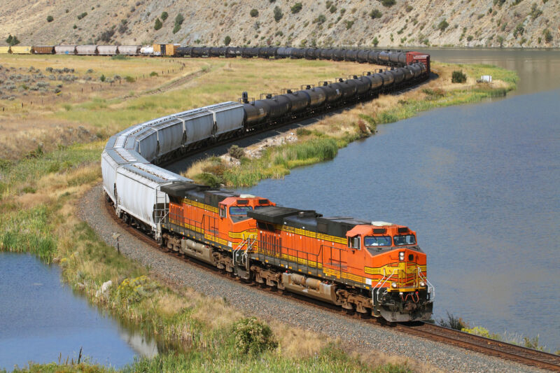 An eastbound manifest freight swoops through a S curve in Lombard Canyon, just east of Toston, Montana, on September 11, 2011. The tracks here snake along the Missouri River between Toston and Lombard.