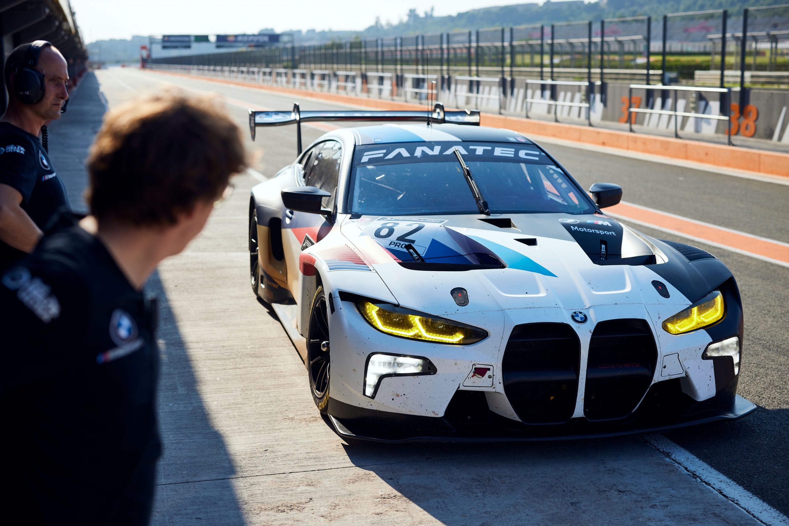 A BMW M4 GT3 race car in the pitlane at Valencia in Spain