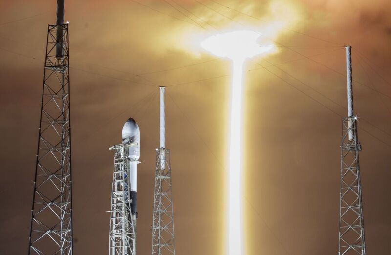 As the Crew-3 mission ascends, a Falcon 9 rocket with a Starlink payload awaits its turn on a nearby launch pad in Florida.