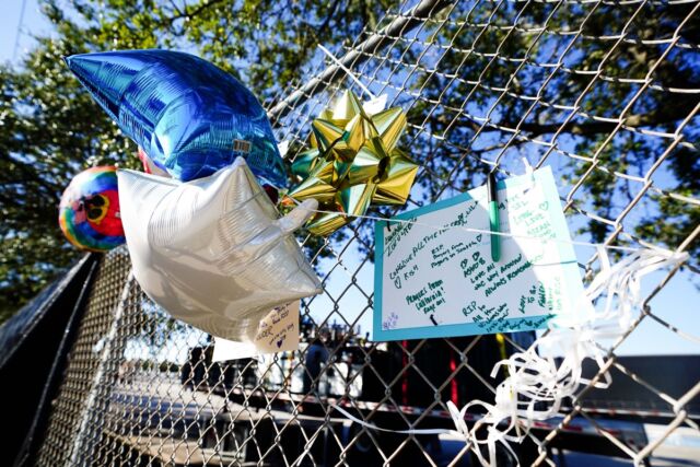 Letters and balloons left outside the canceled Astroworld festival at NRG Park in Houston, Texas, commemorating the eight people killed.