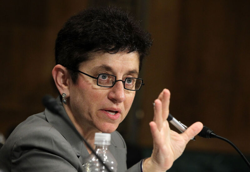 Gigi Sohn speaking and gesturing with her hand while testifying at a Senate hearing.