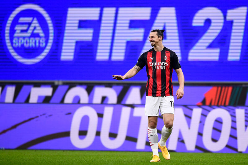 Zlatan Ibrahimovic of AC Milan reacts in front of an EA Sports <em>FIFA 21</em> video game billboard advertising during the Series A football match between AC Milan and Torino FC in 2021. 