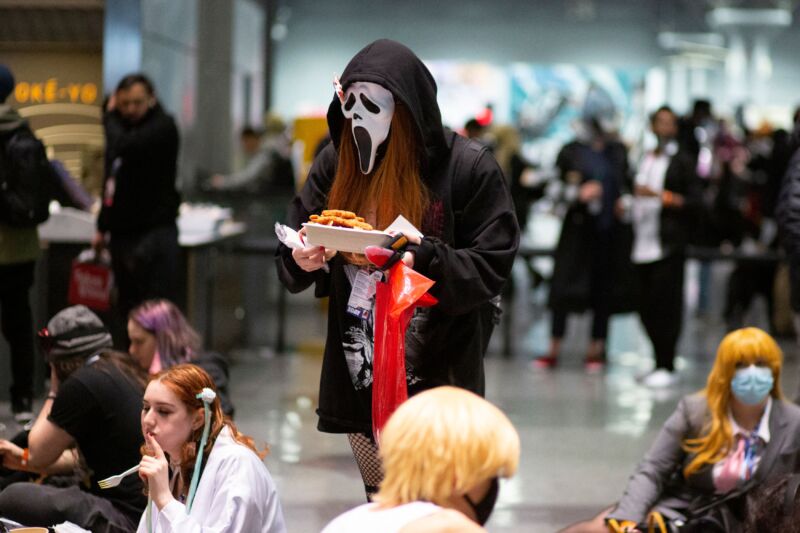 Costumed attendees take a break during Anime NYC at the Jacob K. Javits Convention Center in New York City on November 20, 2021. Anime NYC is an annual three-day anime convention held in New York City. 