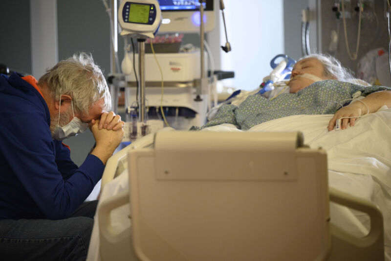 An older couple in a hospital.