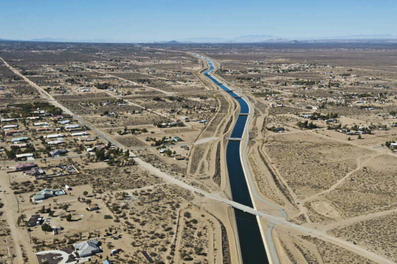 Image of a canal running through very dry terrain.
