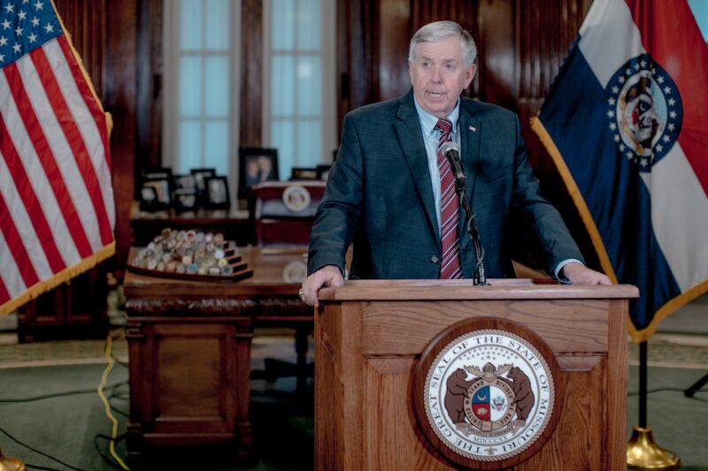 Missouri Gov. Mike Parson speak from behind a podium during a press conference