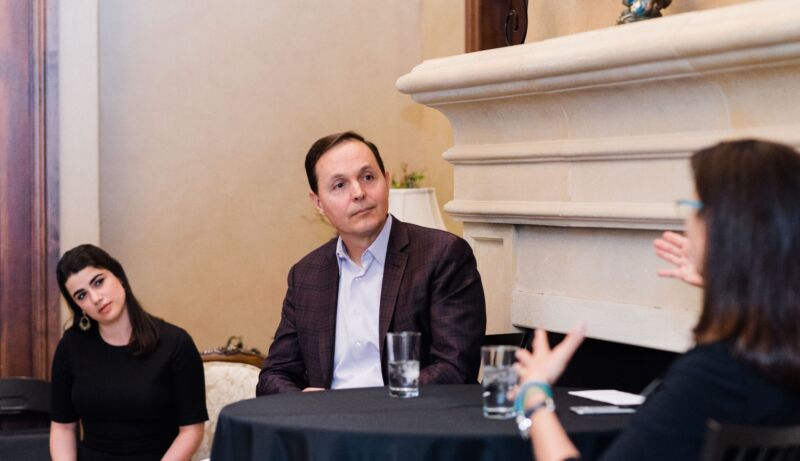 Dylan Taylor listens as former astronaut Nicole Stott speaks during a Space For Humanity event in early 2020. The organization's executive director, Rachel Lyons, is in the background.