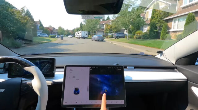 <em>Sky Force Reloaded</em> running on a Tesla's central screen while the car is driving down the road.
