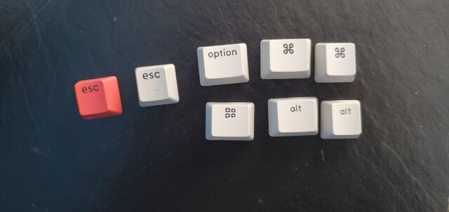 The keyboard comes with two Esc keycaps, as well as the Cap (top right) and Windows (bottom right) layouts for Macs.