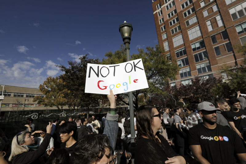 A Google employee holds a sign during a walkout to protest how the tech giant handled sexual misconduct at Jackson Square Park in New York on Thursday, Nov. 1, 2018.