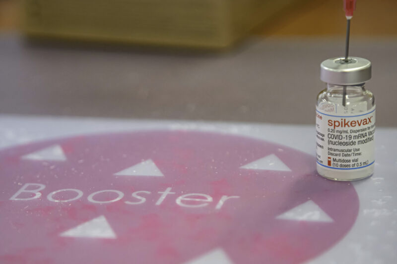 EINDHOVEN, NETHERLANDS - 2022/01/08: A vial containing Moderna COVID-19 booster vaccine at a vaccination centre.