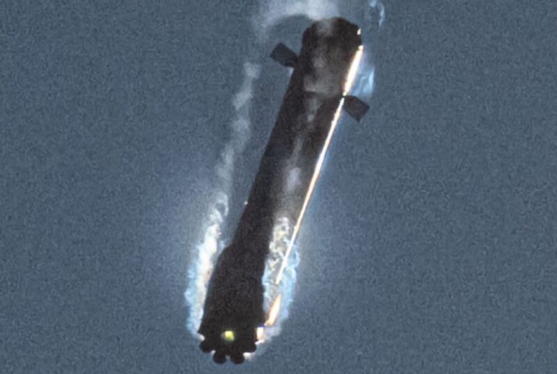 Grainy photograph of smoke-haloed rocket.