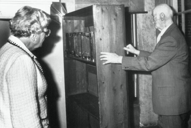 Otto Frank, father of Anne, shows Queen Juliana of The Netherlands the hiding place of the Frank family during World War II. 