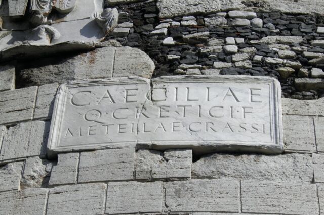 A plaque on the tomb reads: "To Caecilia Metella, daughter of Quintus Creticus, [and wife] of Crassus."