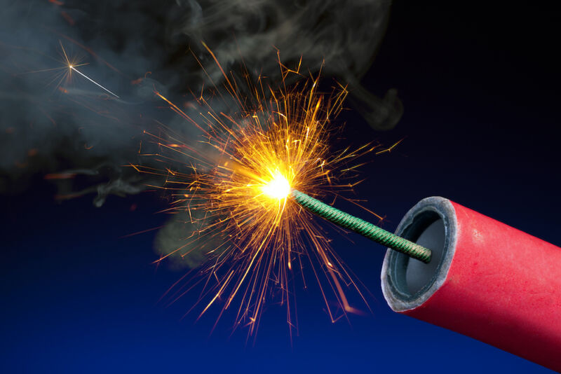 Technology Stock photo of the lit fuse of a stick of dynamite or firework.
