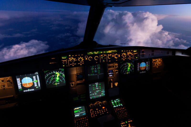 An airplane cockpit seen during flight.