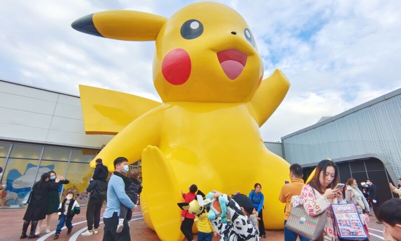 Visitors view a 10-meter-tall Pikachu glass and steel sculpture in Shanghai, China On November 28, 2021.