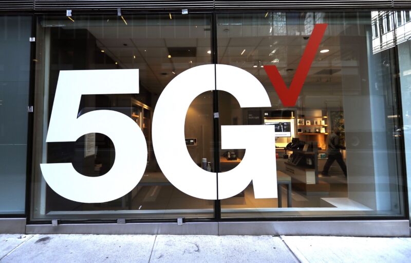 Verizon store front displays a large 5G sign.