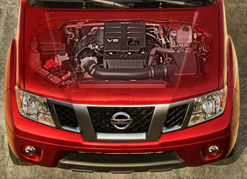 A composite photo showing a V6 under the hood of a Nissan truck