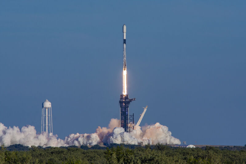 A Falcon 9 rocket launches on a pillar of fire in January 2022.