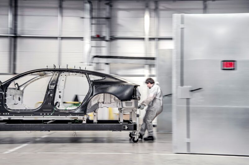 A Polestar 5 chassis being wheeled around Polestar's R&D center.