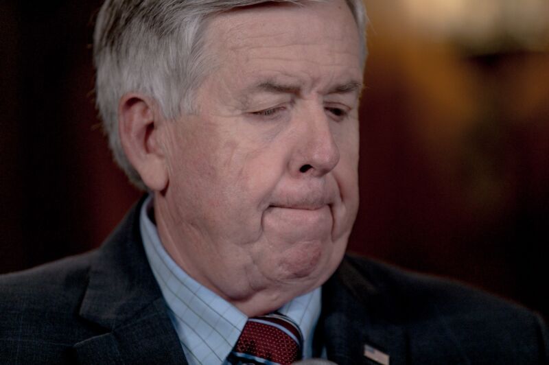 Missouri Gov. Mike Parson listens to a question at a press conference.