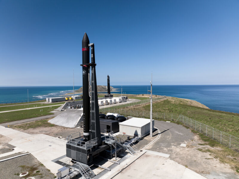 Giant rocket launch pads on a Pacific seashore.