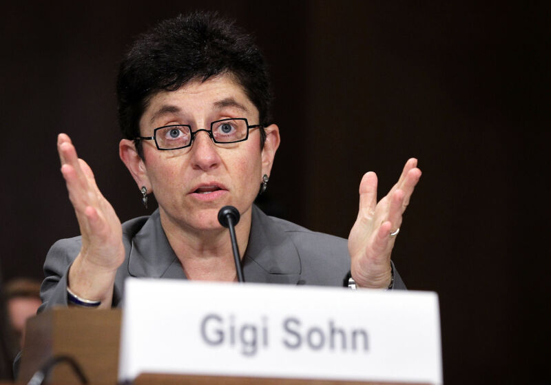 Technology Gigi Sohn speaking and gesturing with her hands while testifying at a Senate hearing.