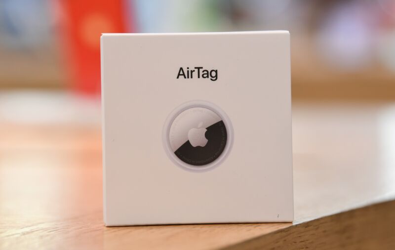 An Apple AirTag box on a table.