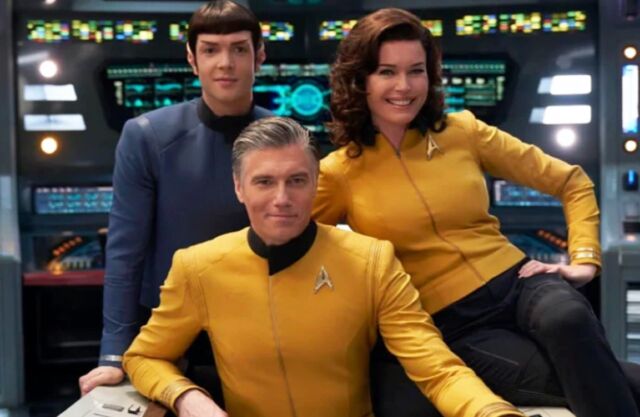 Anson Mount (center) as Capt. Pike, flanked by Ethan Peck (left) as Spock and Rebecca Romijn (right) as Number One.