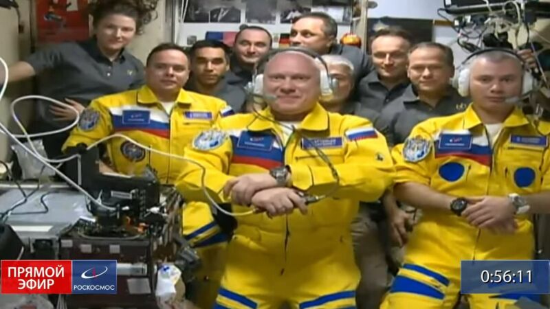 Oleg Artemyev, Denis Matveev, and Sergey Korsakov participate in a news conference after docking with the International Space Station.