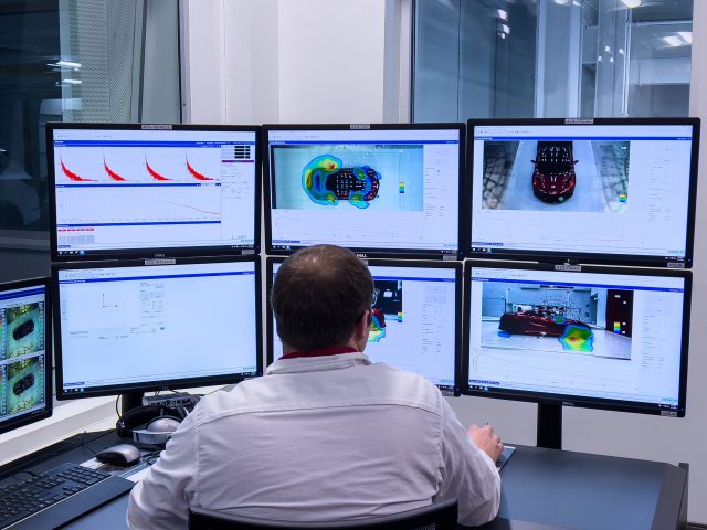 An engineer supervises an aeroacoustic test in the wind tunnel.