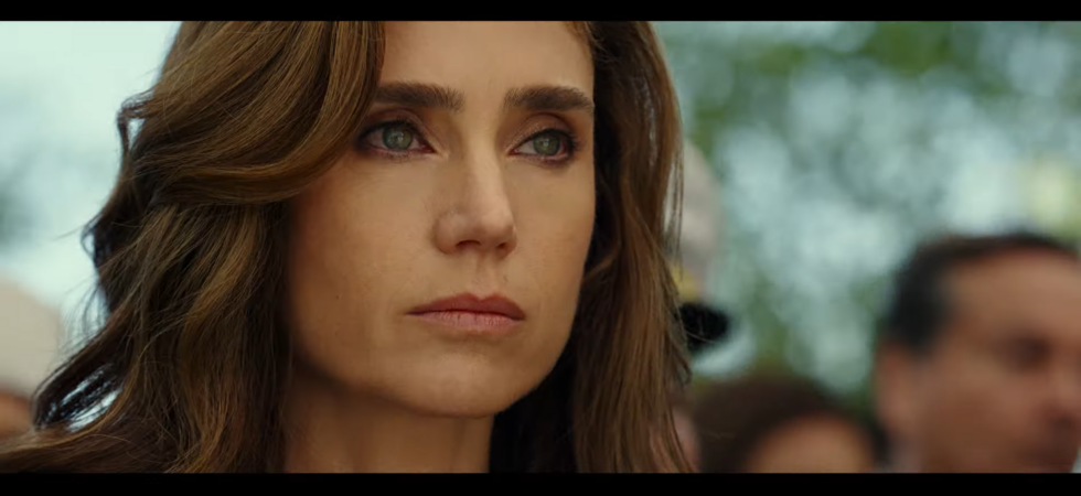 New series character Penny (Jennifer Connelly) foreshadows at least one bummer moment in the film by appearing here at a funeral.