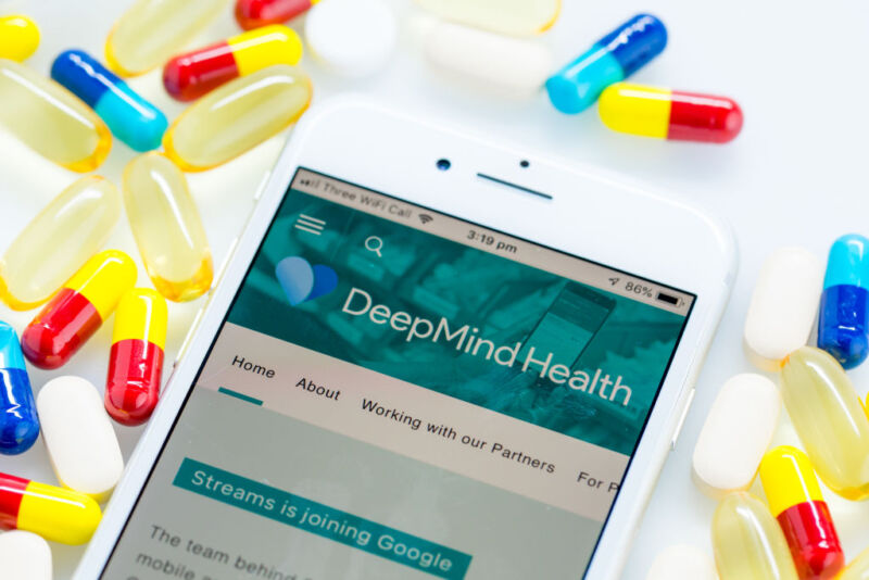 A Deepmind Health webpage sits displayed on the screen of an Apple Inc. iPhone in this arranged photograph in London, U.K. on Monday, Nov. 26, 2018. Three years ago, artificial intelligence company DeepMind Technologies Ltd. embarked on a landmark effort to transform health care in the U.K. Now plans by owner Alphabet Inc. to wrap the partnership into its Google search engine business are tripping alarm bells about privacy. Photographer: Jason Alden/Bloomberg via Getty Images