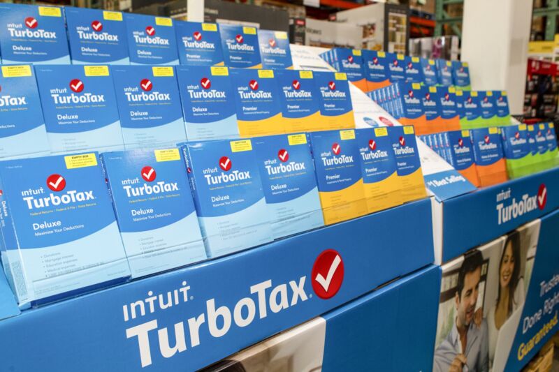 Boxed versions of TurboTax software sit on a store shelf.