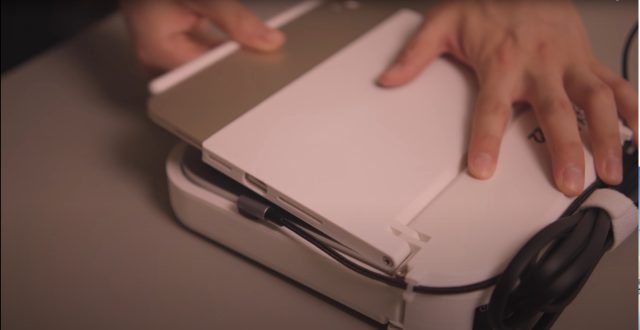 Inserting the iPad Mini into the 3D-printed chassis.