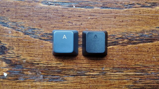 ABS keycaps (left) tend to be smoother, while PBT keycaps (right) generally have more texture.