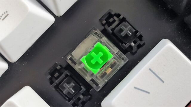 Black stabilizers are on the left and right of the backspace key's Razer Green mechanical swatch. 