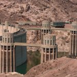Image of a dam with lots of exposed concrete above the water line.