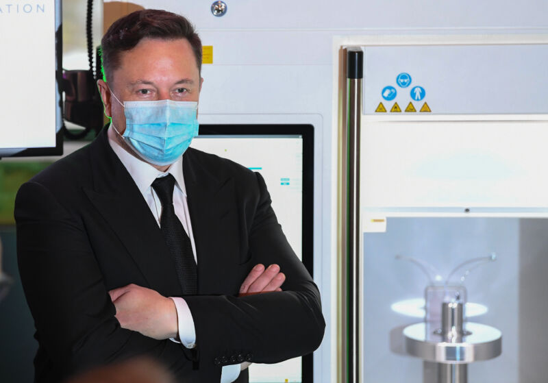 Tesla and SpaceX CEO Elon Musk presents a vaccine production device during a meeting September 2, 2020 in Berlin, Germany. Musk met with vaccine maker CureVac, with which Tesla has a cooperation to build devices for producing RNA vaccines.