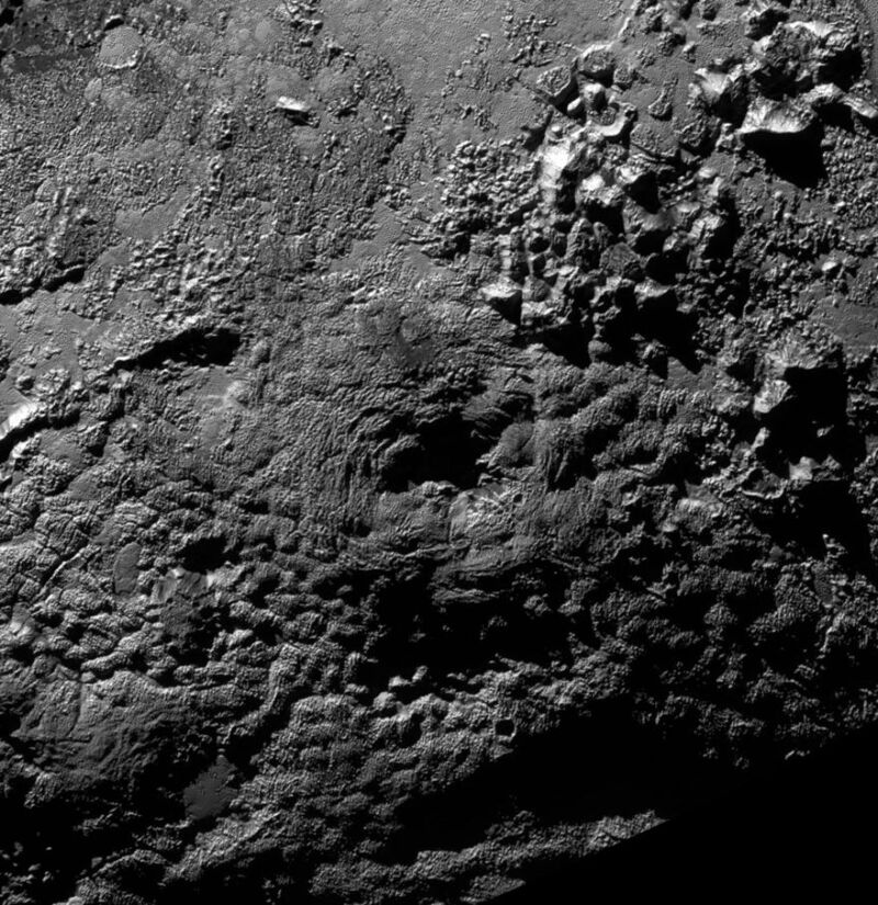 Greyscale image of a complex planetary surface.