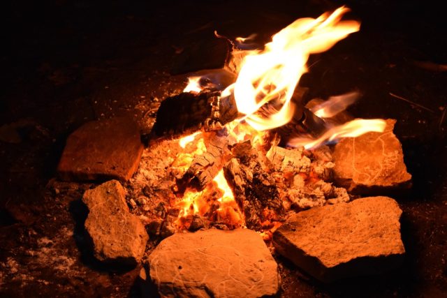 Photograph showing ambient light levels and the position of replica plaquettes in relation to the fire during one of the experiments.