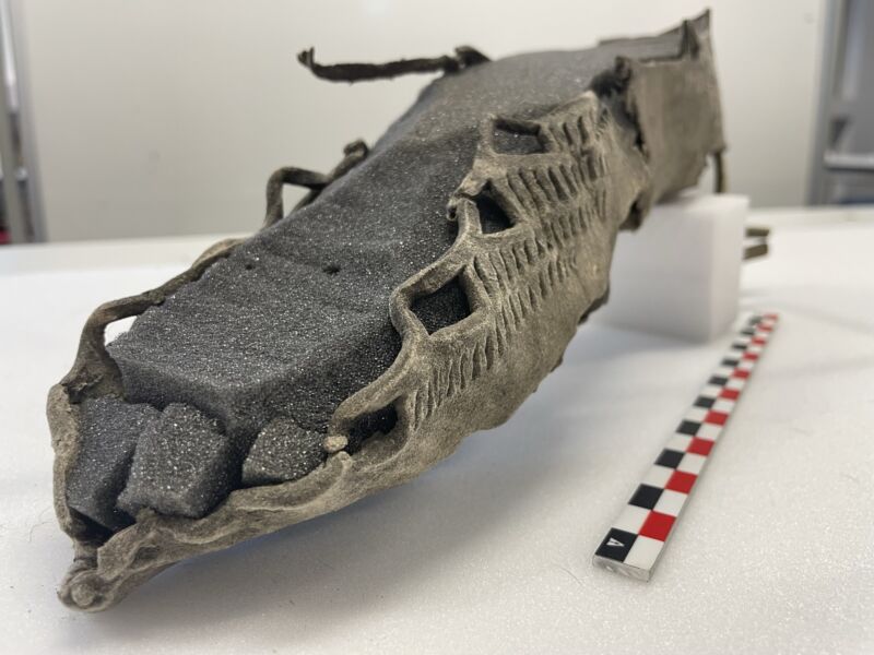 ancient leather shoe molded to a foam foot form