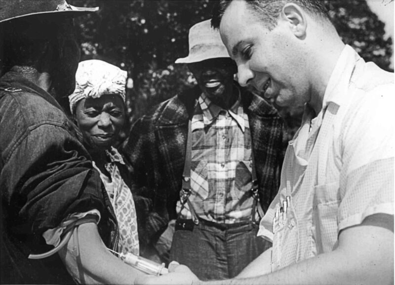 Dr. Walter Edmondson of PHS draws a blood sample from a Tuskegee study participant in Milstead, Macon County, Georgia, 1953.