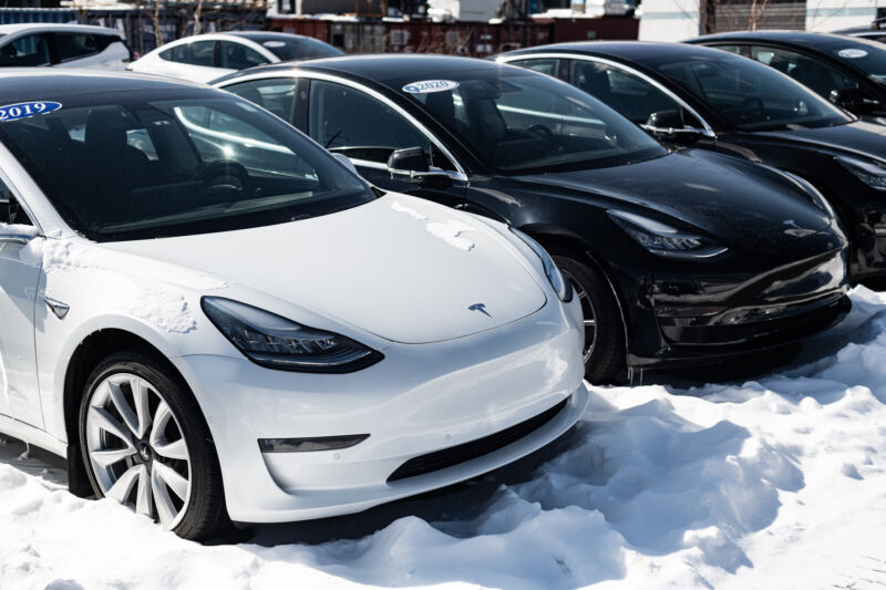 Used Tesla model 3 sedans available to purchase at an all-EV dealership.