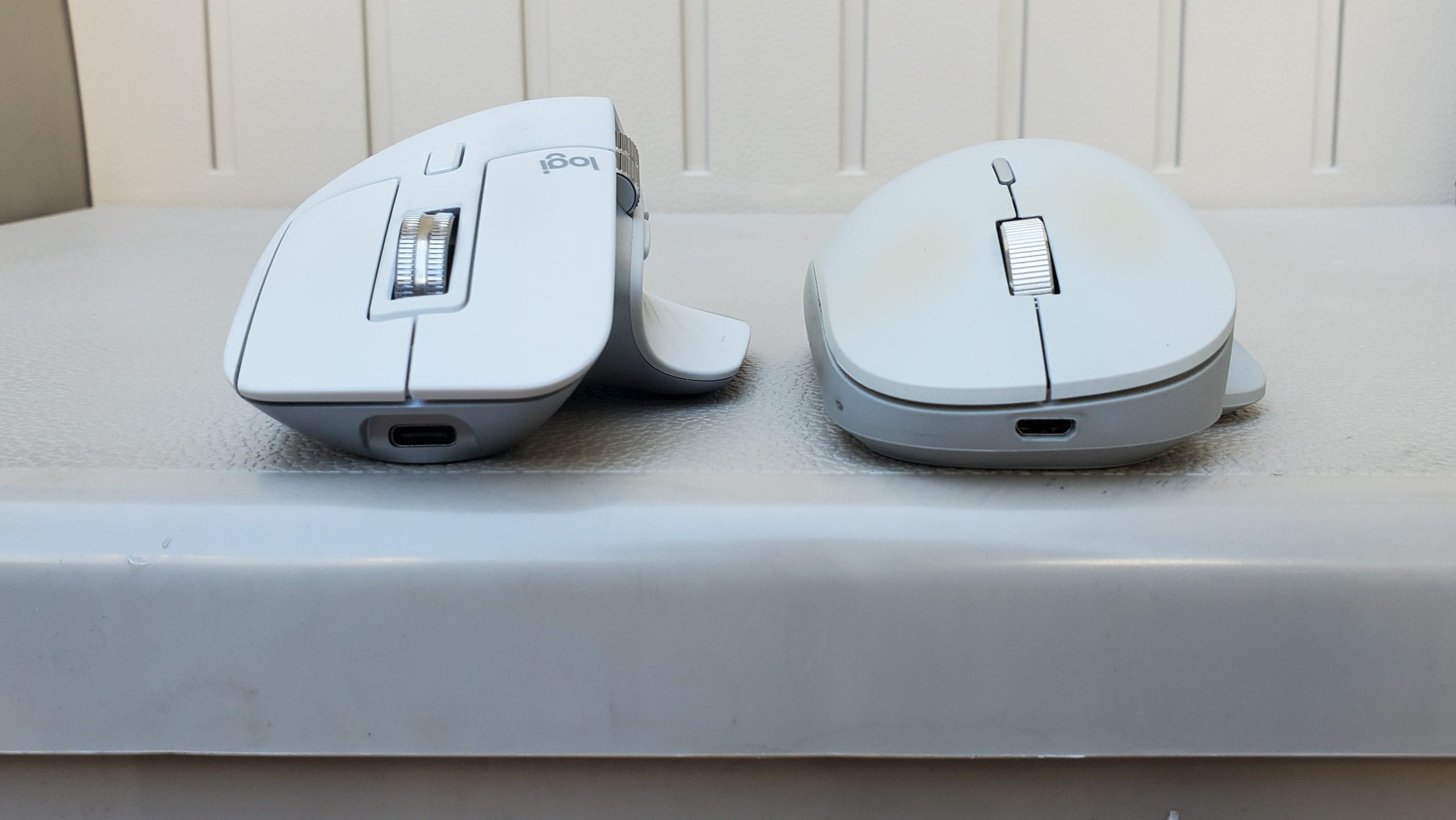 Logitech MX Master 3S next to Microsoft Surface Precision