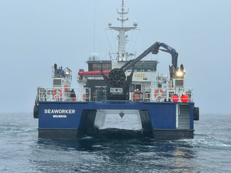 After being caught by a helicopter, and then dropped into the sea, an Electron booster is brought back to New Zealand by boat on Tuesday.