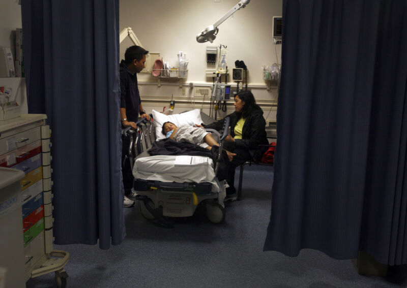 Parents look after their son, age 5, who is being treated for croup and asthma in an emergency room at a California hospital March 24, 2010.